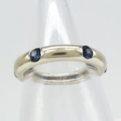 A pre-owned 18ct white gold round transition-cut sapphire band