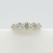 A certificated traditional graduated 5-stone 0.73ct diamond ring in 18ct white and yellow gold