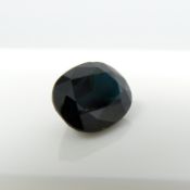 A single, unmounted, oval-cut natural sapphire gemstone weighing 2.46 ct