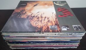 A collection of 34 x vinly record Lps.