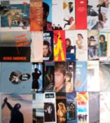 A collection of 75 x vinyl records.