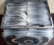 A collection of 250 plus vinyl records in clear protective covers.