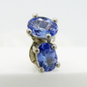 Pair of natural tanzanite ear studs in silver, with butterfly backs