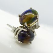 Silver ear studs set with cabochon Ethiopian galaxy black opals
