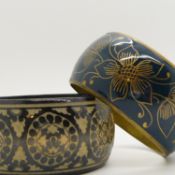 Two large patterned costume bangles, both 36mm wide