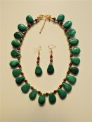 An Emerald and Ruby Necklace and Earrings Set