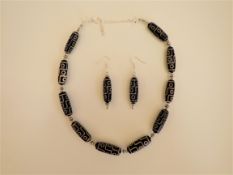 A Tibetan Dzi Necklace and Earrings Set