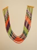 A Nine Strand Gem Loaded Necklace