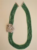 A Six Strand Emerald Necklace With a Statement Cz Rose.