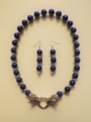 A Lapis Lazuli and Pearl Necklace and Earrings Set.