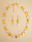 A Coin Shaped Pearl Necklace and Earrings Set.