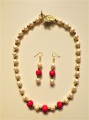 A Genuine Pearl and Red Coral Necklace and Earrings Set.