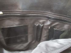 Ladies black leather tote as pictured has some marks , previous use -