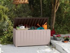 (61/P) RRP £90. Keter Novel Deck Box Beige/Brown. 340L Storage Capacity. Combines An Attractive,...