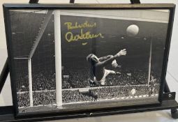 Signed framed image of 'Alex Stepney' playing for Manchester United Football Club with COA