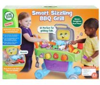 (59/6D) Lot RRP £103. 2x Items. 1x Leap Frog Smart Sizzling BBQ Grill RRP £53. 1x Evo Rainbow Bla...