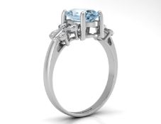 9ct White Gold Diamond And Blue Topaz Ring
