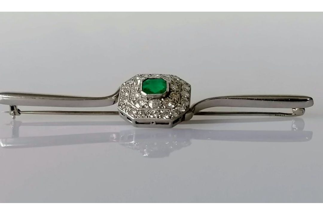 An Art Deco emerald and diamond platinum brooch, the emerald 5mm x 6mm, thirty-one round-cut diamond - Image 2 of 5