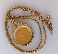 An Edwardian gold half sovereign, 1910, on a 9ct gold mount and chain, hallmarked, chain damaged, 9.