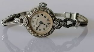 An Art Deco ladies platinum-cased diamond-set manual cocktail watch on a later 9ct white gold bracel