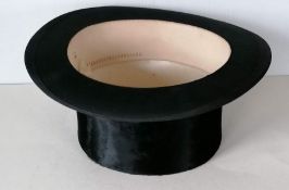 A silk top hat by Dunn & Co., Oxford Street with fitted box, rim size approx 21