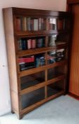 A matching set of three Art Deco oak-stained barrister bookcases in the Globe Wernicke style, the la