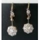 A pair of white and yellow metal diamond earrings, the central round-cut diamond approximately 0.20 - Image 3 of 6