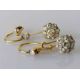 A pair of white and yellow metal diamond earrings, the central round-cut diamond approximately 0.20 - Image 1 of 6