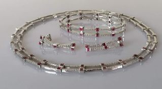 A ruby and diamond parure on a white gold setting