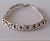 A sapphire and diamond necklace on a white gold setting, approximate total diamond weight 4.00 carat