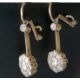 A pair of white and yellow metal diamond earrings, the central round-cut diamond approximately 0.20 - Image 5 of 6
