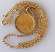 A Victorian gold half sovereign, 1900, on a 9ct gold mount and chain, hallmarked, 7.5g