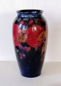 A William Moorcroft tube-lined vase decorated in the 'Pomegranate' design, impressed marks Moorcroft