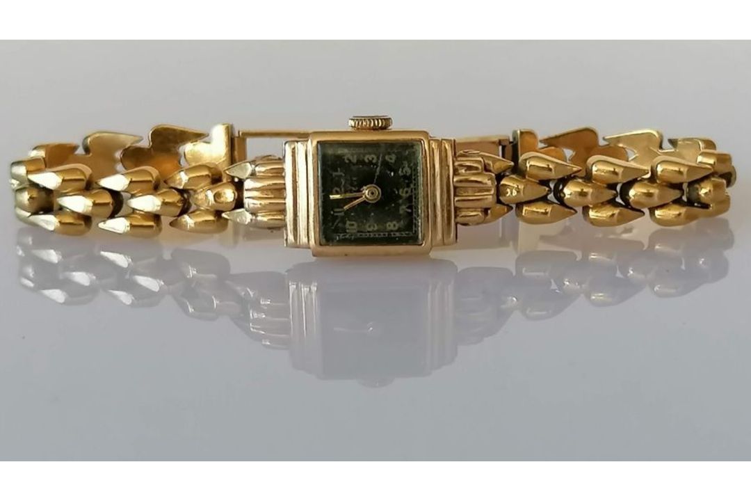 A vintage ladies gold dress watch with black face and Arabic numerals, Swiss mechanism on an 18ct go - Image 1 of 3