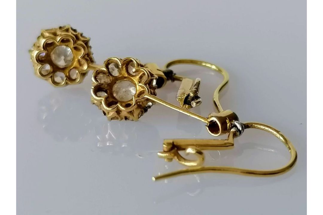 A pair of white and yellow metal diamond earrings, the central round-cut diamond approximately 0.20 - Image 6 of 6