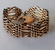 A 9ct yellow gold gate-link bracelet with padlock, hallmarked, 23g