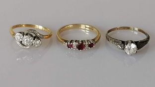 A three-stone diamond ring in an illusion setting on an 18ct gold and sapphire setting, size M, 3g;