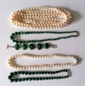 An opera length single strand of cream cultured pearls,