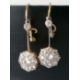 A pair of white and yellow metal diamond earrings, the central round-cut diamond approximately 0.20 - Image 4 of 6