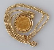 A QEII gold half sovereign, 1983, on a 9ct gold mount and chain, both hallmarked, 11.6g