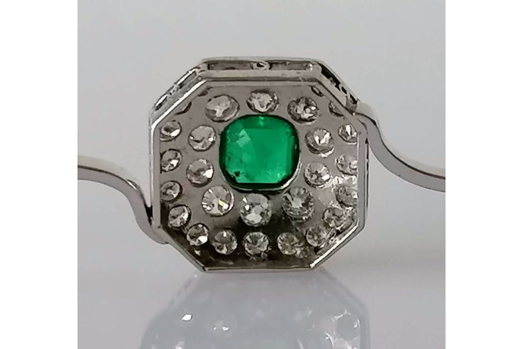 An Art Deco emerald and diamond platinum brooch, the emerald 5mm x 6mm, thirty-one round-cut diamond - Image 5 of 5