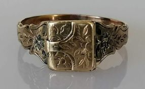 A Victorian gold memorial or mourning locket ring opening to reveal an inner well, etched decoration