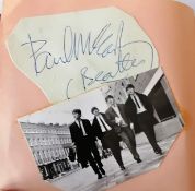 A mid-20th century book of autographs to include Paul McCartney, Tom Jones, Laurel & Hardy, Cilla