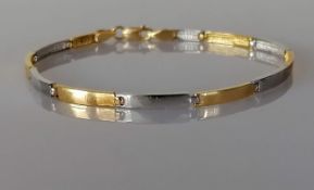 A white and yellow gold link bracelet, 75mm, stamped 750, 7.5g