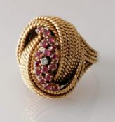 An Italian gold wire knot ring with garnet and diamond decoration, size P, unmarked, tests for 18ct,