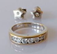 A white gold half hoop eternity ring with six round brilliant-cut diamonds, each approximately 0.075