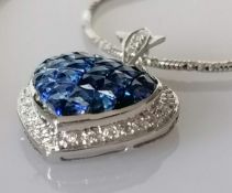 A heart-shape sapphire encrusted pendant, mystery-set, 17 x 17mm, on white metal and an 18ct white