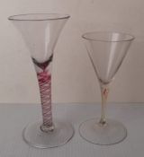 An 18th century lead wine glass with bell bowl and red multi spiral colour stem and plain foot,