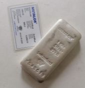 A Metalor 1 kg 999.0 silver bar with certificate, number K 045019
