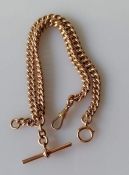 A 9ct rose gold flat curb-link Albert chain with T-bar and one lobster clasp, each link stamped